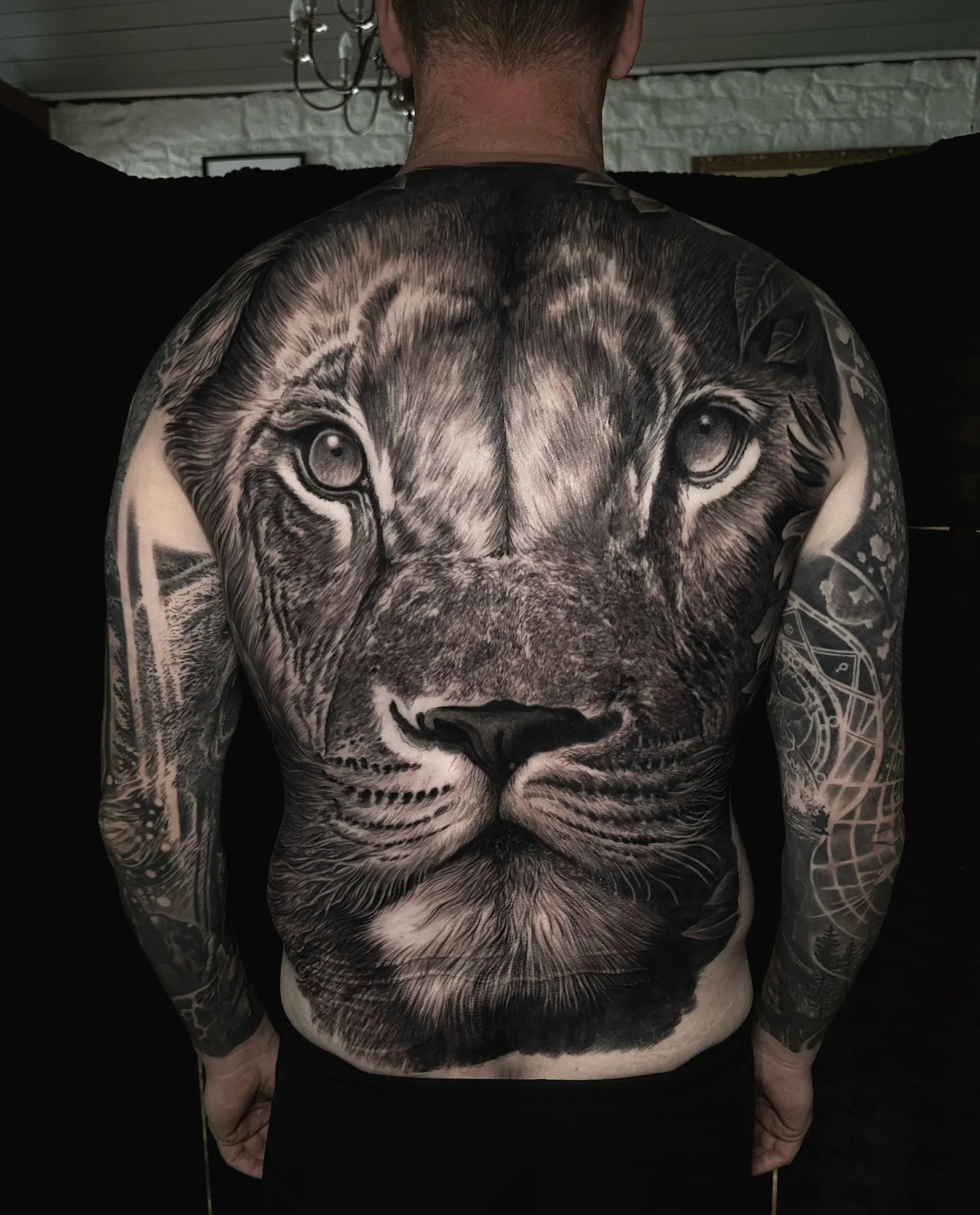The same lioness back piece, finished in black and grey